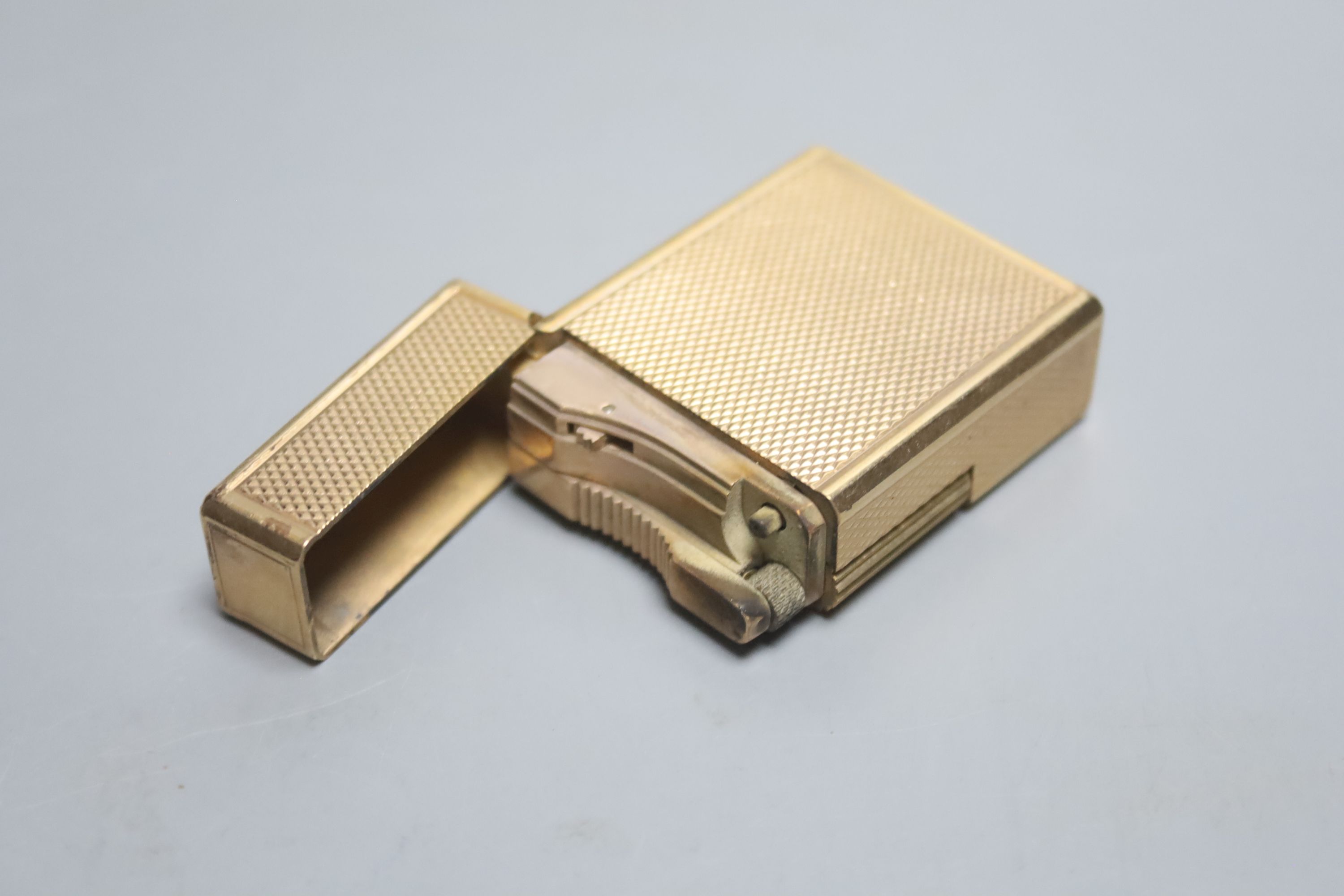 A vintage S.T. Dupont gold plated lighter